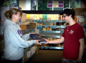 WSU Bookstore staff (like Amy Schmidtknecht, above) help you (and Josh Denzer, above) through the book-buying process.